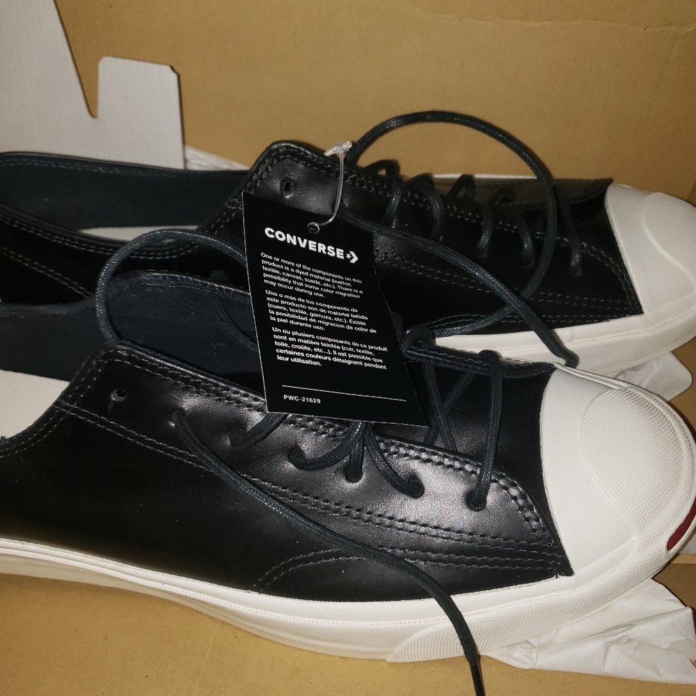 Black leather look Converse. They are a mens 12 or 13.5 in womens. Never worn